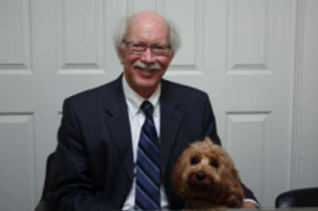 Photo of attorney Stanley W. West with dog
